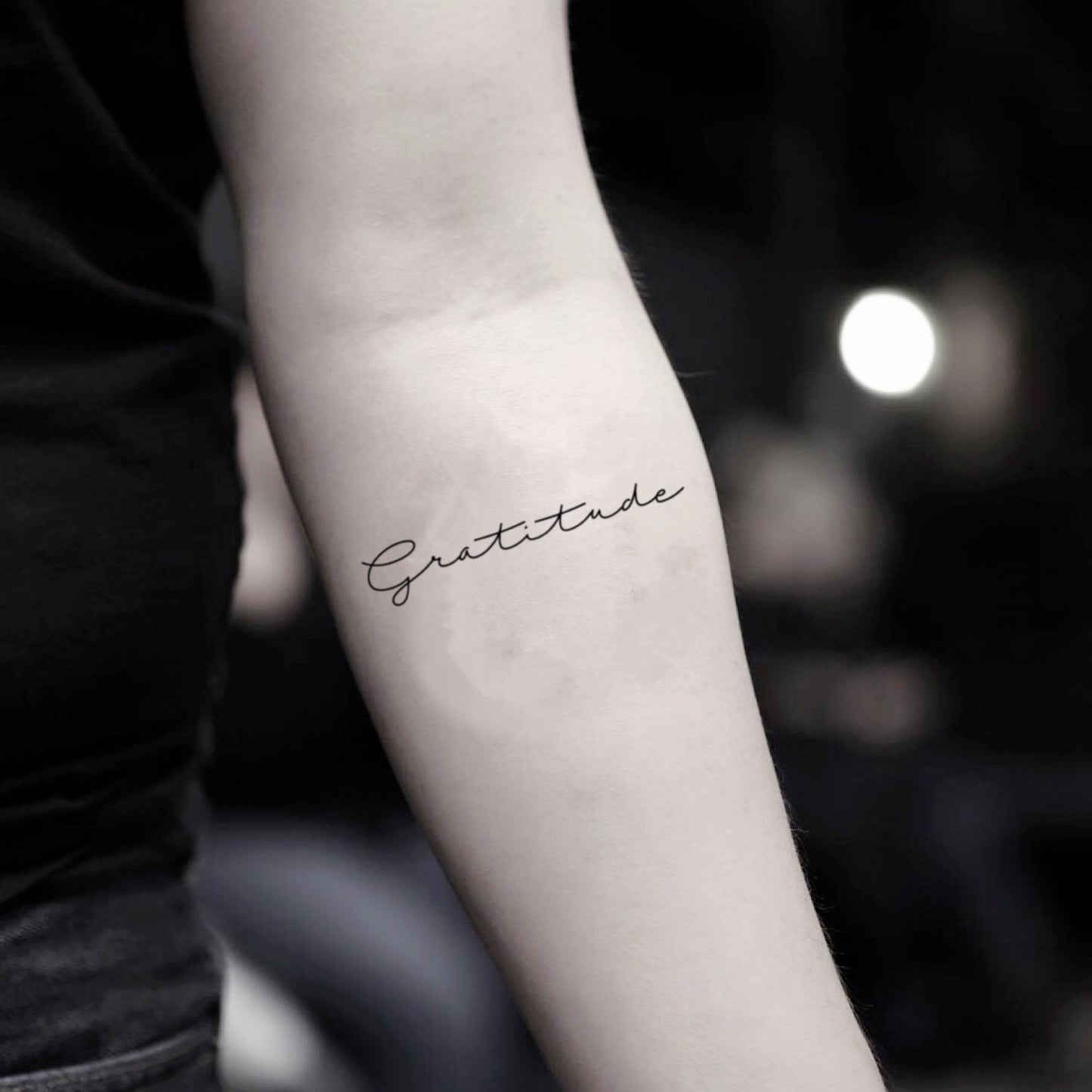 fake small gratitude lettering temporary tattoo sticker design idea on inner arm