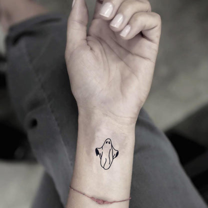 fake small halloween ghost minimalist temporary tattoo sticker design idea on wrist