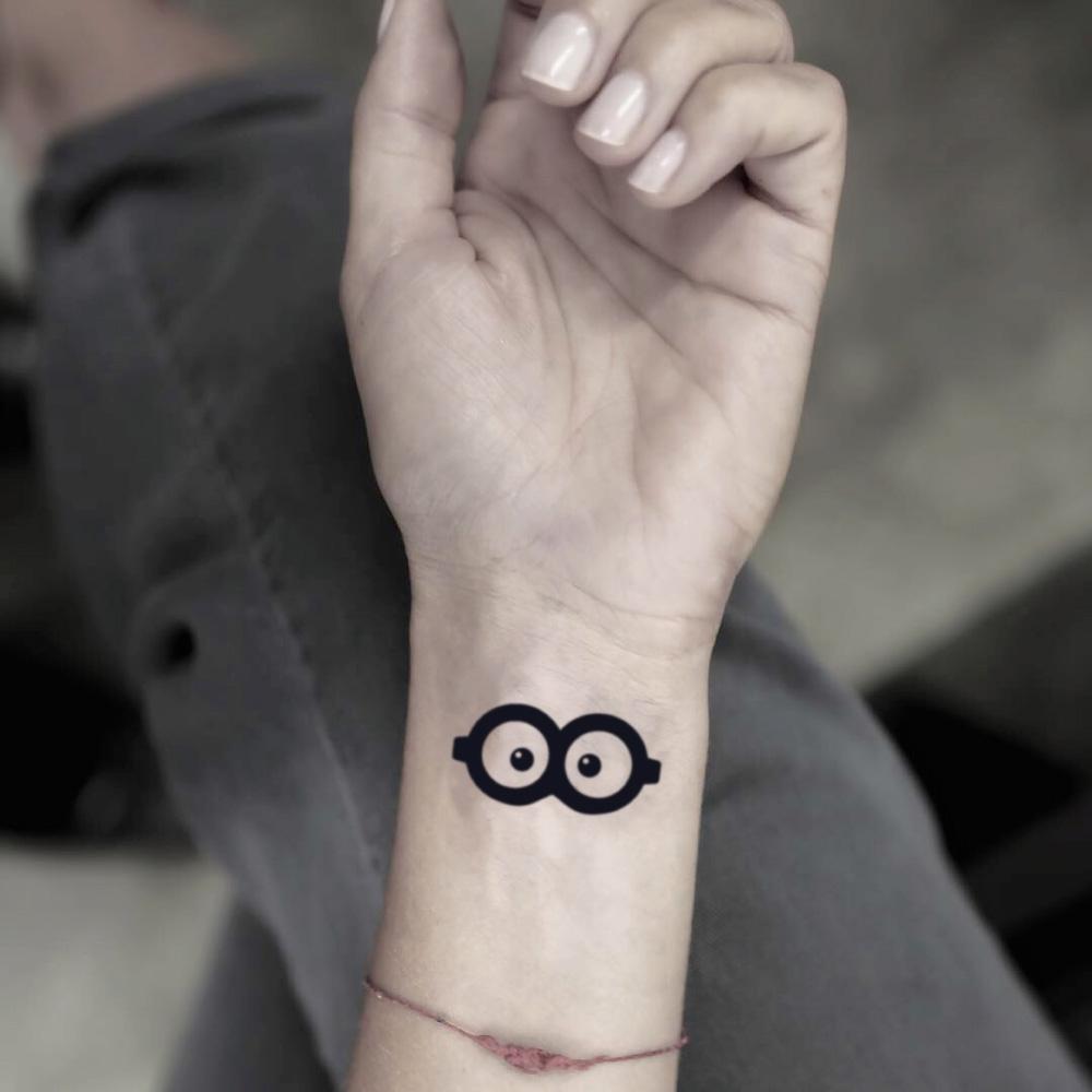 fake small minion glasses cartoon temporary tattoo sticker design idea on wrist