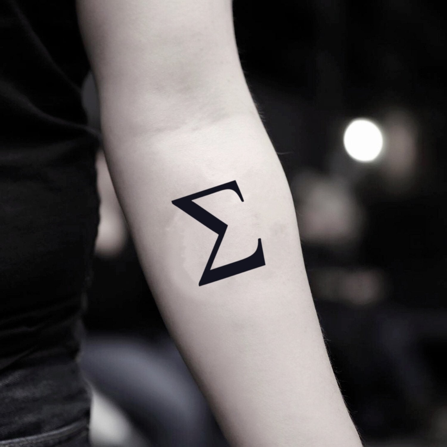 fake small sigma minimalist temporary tattoo sticker design idea on inner arm